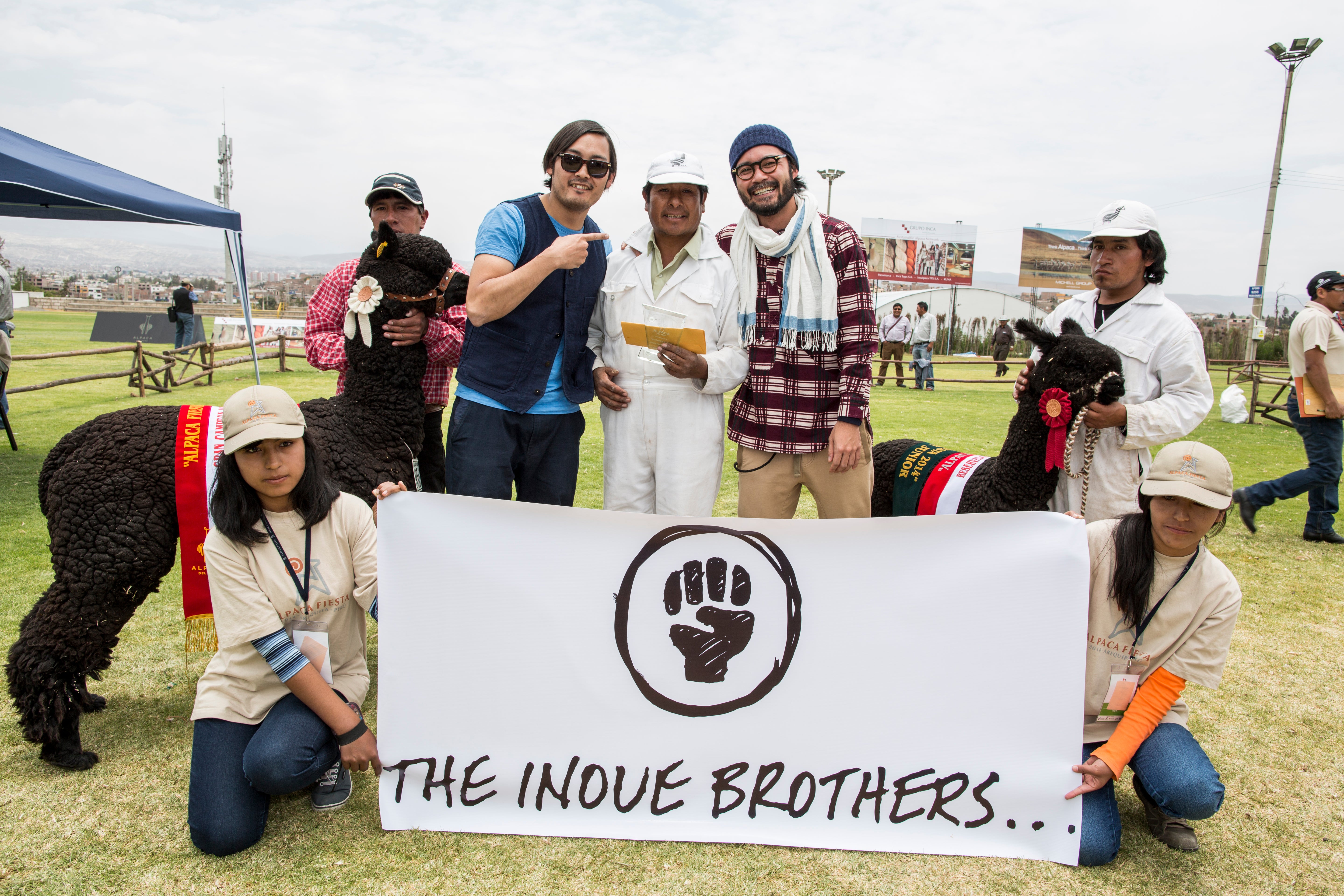 Presenting the inaugural first "Black Alpaca" prize to the winning herder.